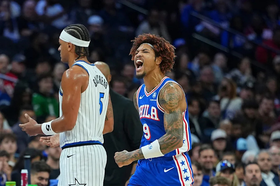 PHILADELPHIA, PENNSYLVANIA - OCTOBER 27: Kelly Oubre Jr. #9 of the Philadelphia 76ers reacts in front of Paolo Banchero #5 of the Orlando Magic in the first half at Xfinity Mobile Arena on October 27, 2025 in Philadelphia, Pennsylvania. NOTE TO USER: User expressly acknowledges and agrees that, by downloading and or using this photograph, User is consenting to the terms and conditions of the Getty Images License Agreement. (Photo by Mitchell Leff/Getty Images)