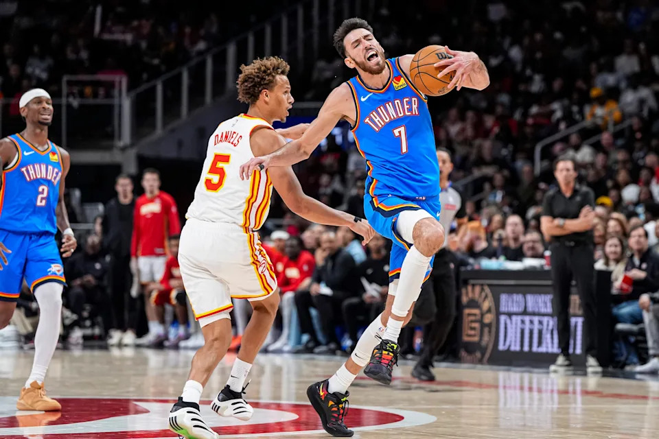 Oct 25, 2025; Atlanta, Georgia, USA; Oklahoma City Thunder center Chet Holmgren (7) is fouled by Atlanta Hawks guard Dyson Daniels (5) during the second half at State Farm Arena. Mandatory Credit: Dale Zanine-Imagn Images