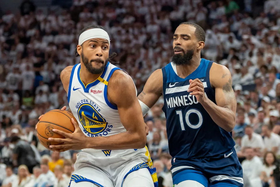 May 14, 2025; Minneapolis, Minnesota, USA; Golden State Warriors guard Moses Moody (4) drives to the basket past Minnesota Timberwolves guard Mike Conley (10) in the second half during game five of the second round for the 2025 NBA Playoffs at Target Center. Mandatory Credit: Jesse Johnson-Imagn Images