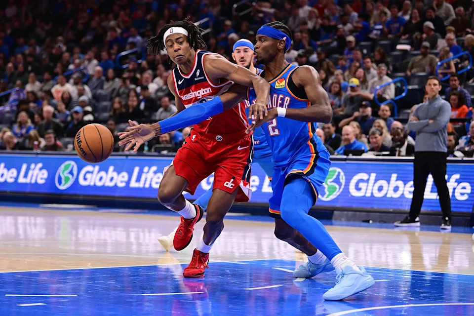 Washington Wizards rookie Tre Johnson gets the ball poked free by Shai Gilgeous-Alexander from the Oklahoma City Thunder.