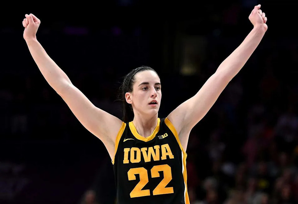 Nov. 9, 2023: Iowa’s Caitlin Clark raises her arms in celebration as the buzzer sounds at Spectrum Center in Charlotte. Iowa defeated Virginia Tech 80-76 in the Ally Tipoff, with Clark scoring 44 points.