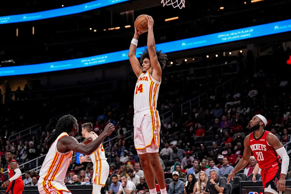 Oct 16, 2025; Atlanta, Georgia, USA; Atlanta Hawks forward Asa Newell (14) grabs a rebound against the Houston Rockets during the second half at State Farm Arena.