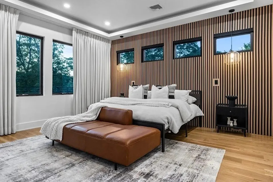 Bedroom with detailed wall in a luxury home in Massachusetts that belongs to Jrue Holiday