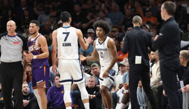 Jaylen Wells of the Memphis Grizzlies high fives Santi Aldama #7 after a three-point shot and a fou...