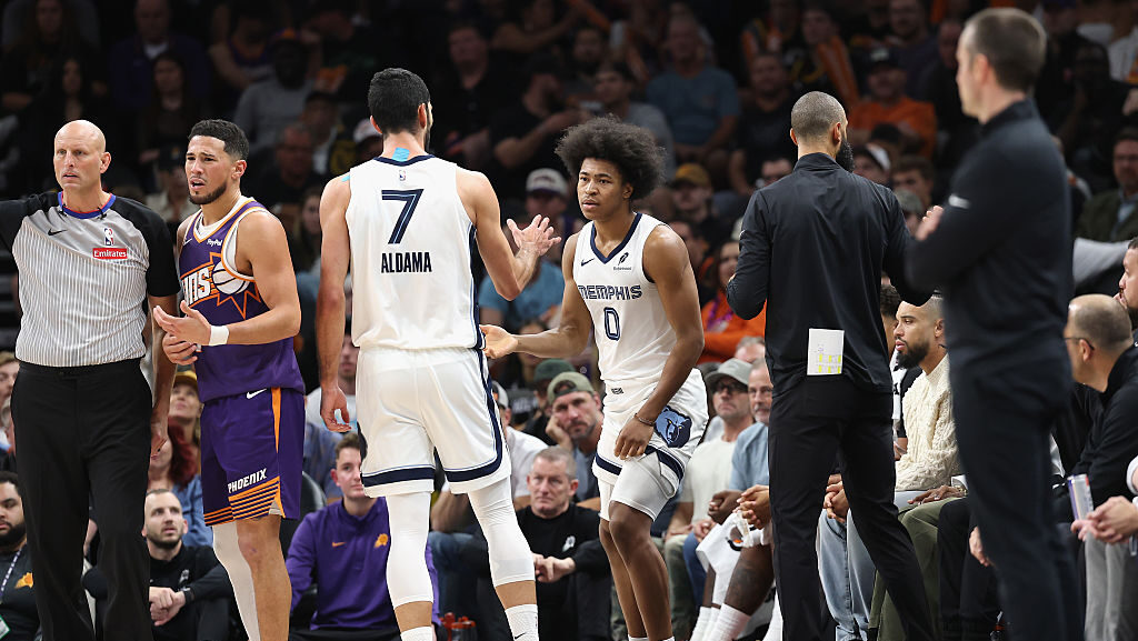 Jaylen Wells of the Memphis Grizzlies high fives Santi Aldama #7 after a three-point shot and a fou...