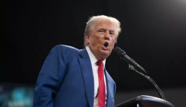 Donald Trump speaking into a microphone