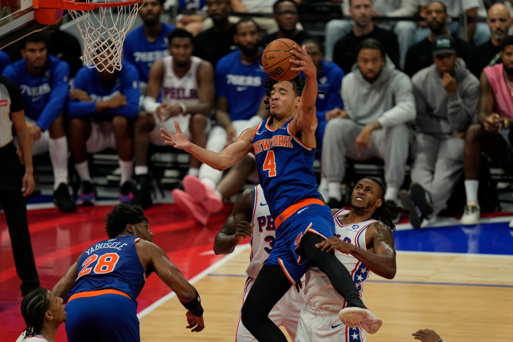 Pacome Dadiet dirves to the basket in the Knicks-76ers game on Oct. 4, 2025.