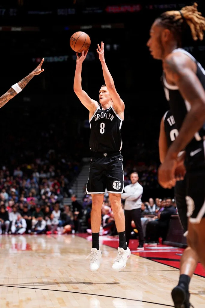 Egor Demin #8 of the Brooklyn Nets shoots a three point basket during the game against the Toronto Raptors on October 17, 2025 at the Scotiabank Arena in Toronto, Ontario, Canada. NBAE via Getty Images