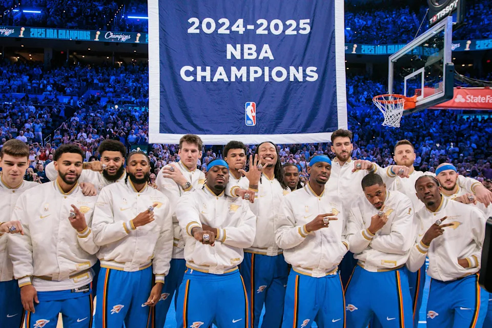 OKLAHOMA CITY, OKLAHOMA - OCTOBER 21: Oklahoma City Thunder players pose with their rings in front of the championship banner prior to the game against the Houston Rockets at Paycom Center on October 21, 2025 in Oklahoma City, Oklahoma. NOTE TO USER: User expressly acknowledges and agrees that, by downloading and or using this photograph, User is consenting to the terms and conditions of the Getty Images License Agreement.(Photo by William Purnell/Getty Images)