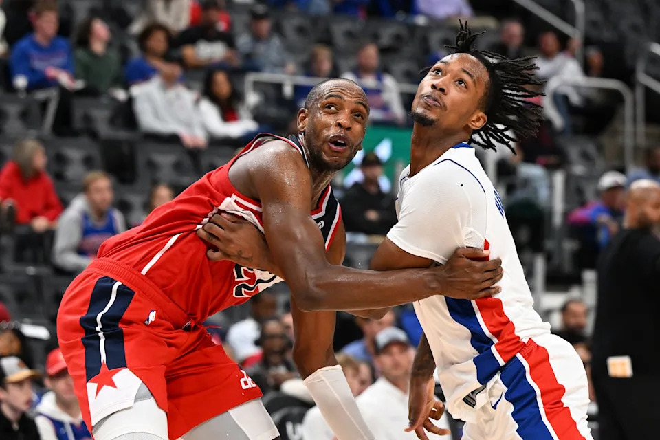 Oct 16, 2025; Detroit, Michigan, USA; Washington Wizards forward Khris Middleton (22) battles for position with Detroit Pistons forward Ronald Holland II (5) on a foul shot in the second quarter at Little Caesars Arena.