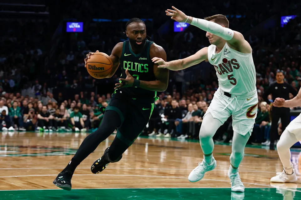 Feb 28, 2025; Boston, Massachusetts, USA; Boston Celtics guard Jaylen Brown (7) drives on Cleveland Cavaliers guard Sam Merrill (5) during the first quarter at TD Garden. Mandatory Credit: Winslow Townson-Imagn Images