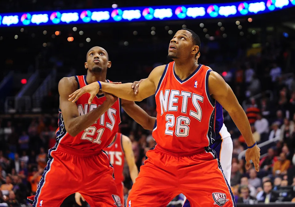 Jan. 12, 2011; Phoenix, AZ, USA; New Jersey Nets forward (26) Stephen Graham and forward (21) Travis Outlaw against the Phoenix Suns at the US Airways Center. The Suns defeated the Nets 118-109 in overtime. Mandatory Credit: Mark J. Rebilas-USA TODAY Sports