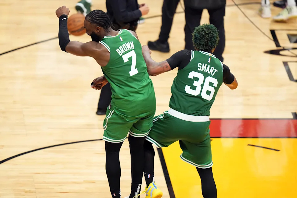 May 27, 2023; Miami, Florida, USA; Boston Celtics guard Jaylen Brown (7) celebrates with guard Marcus Smart (36) after defeating the Miami Heat in game six of the Eastern Conference Finals for the 2023 NBA playoffs at Kaseya Center. Mandatory Credit: Rich Storry-USA TODAY Sports