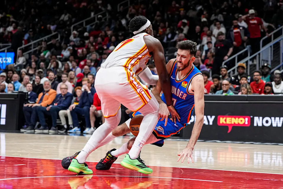 Oct 25, 2025; Atlanta, Georgia, USA; Oklahoma City Thunder center Chet Holmgren (7) is fouled by Atlanta Hawks forward Onyeka Okongwu (17) during the second half at State Farm Arena. Mandatory Credit: Dale Zanine-Imagn Images