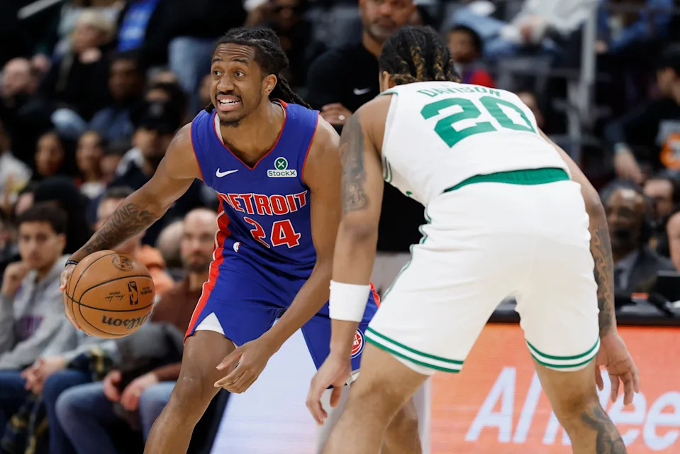 Feb 26, 2025; Detroit, Michigan, USA; Detroit Pistons guard Daniss Jenkins (24) dribbles defended by Boston Celtics guard JD Davison (20) in the second half at Little Caesars Arena. Mandatory Credit: Rick Osentoski-Imagn Images