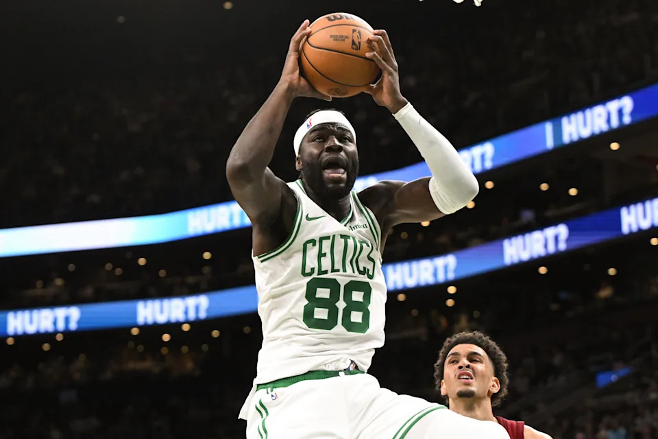 Oct 12, 2025; Boston, Massachusetts, USA; Boston Celtics center Neemias Queta (88) rebounds the ball against the Cleveland Cavaliers during the first half at TD Garden. Mandatory Credit: Brian Fluharty-Imagn Images