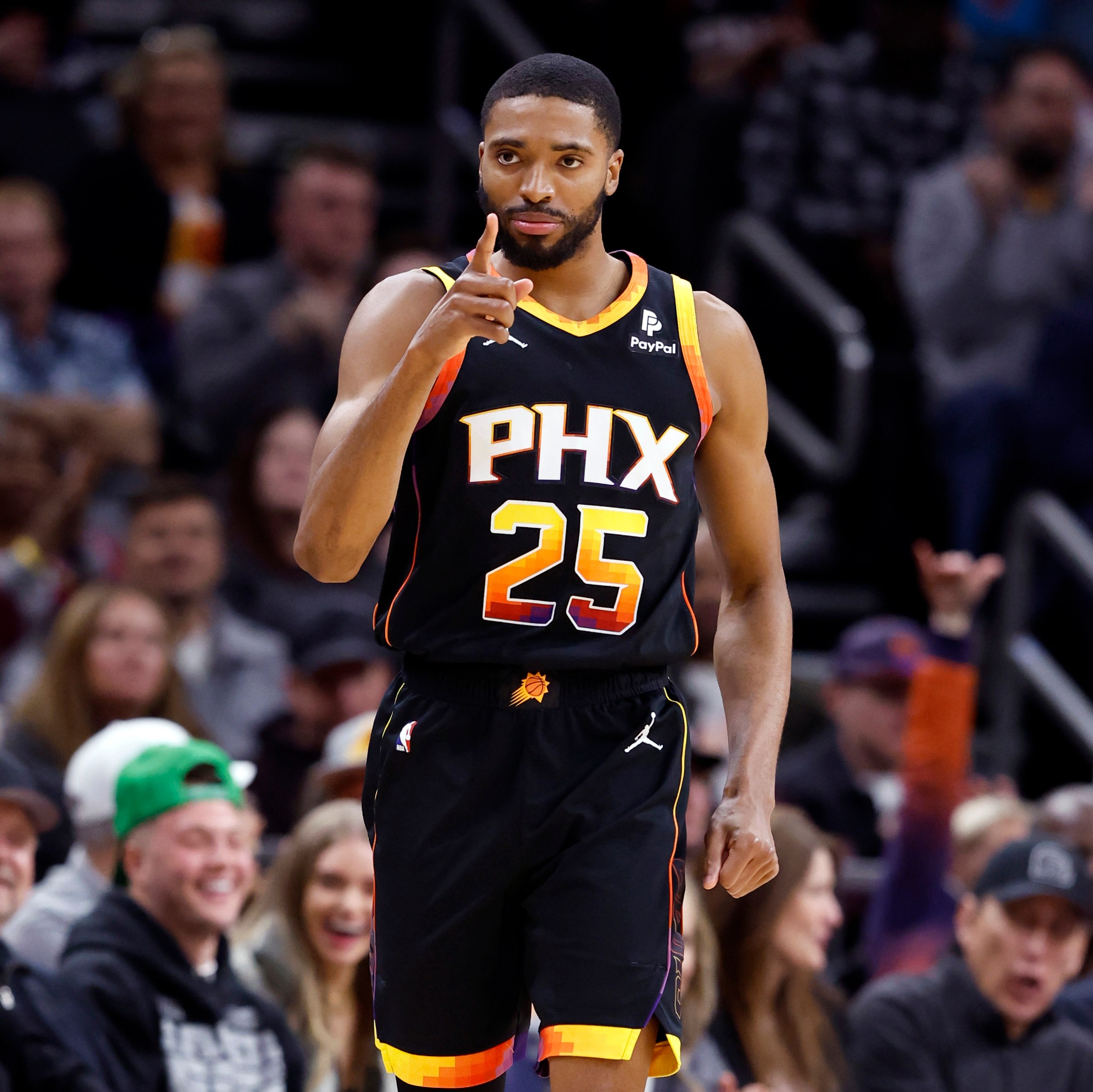 PHOENIX, ARIZONA - FEBRUARY 01: Mikal Bridges #25 of the Phoenix Suns gestures during the game against the Atlanta Hawks at Footprint Center on February 01, 2023 in Phoenix, Arizona. The Hawks beat the Suns 132-100. NOTE TO USER: User expressly acknowledges and agrees that, by downloading and or using this photograph, User is consenting to the terms and conditions of the Getty Images License Agreement. (Photo by Chris Coduto/Getty Images)