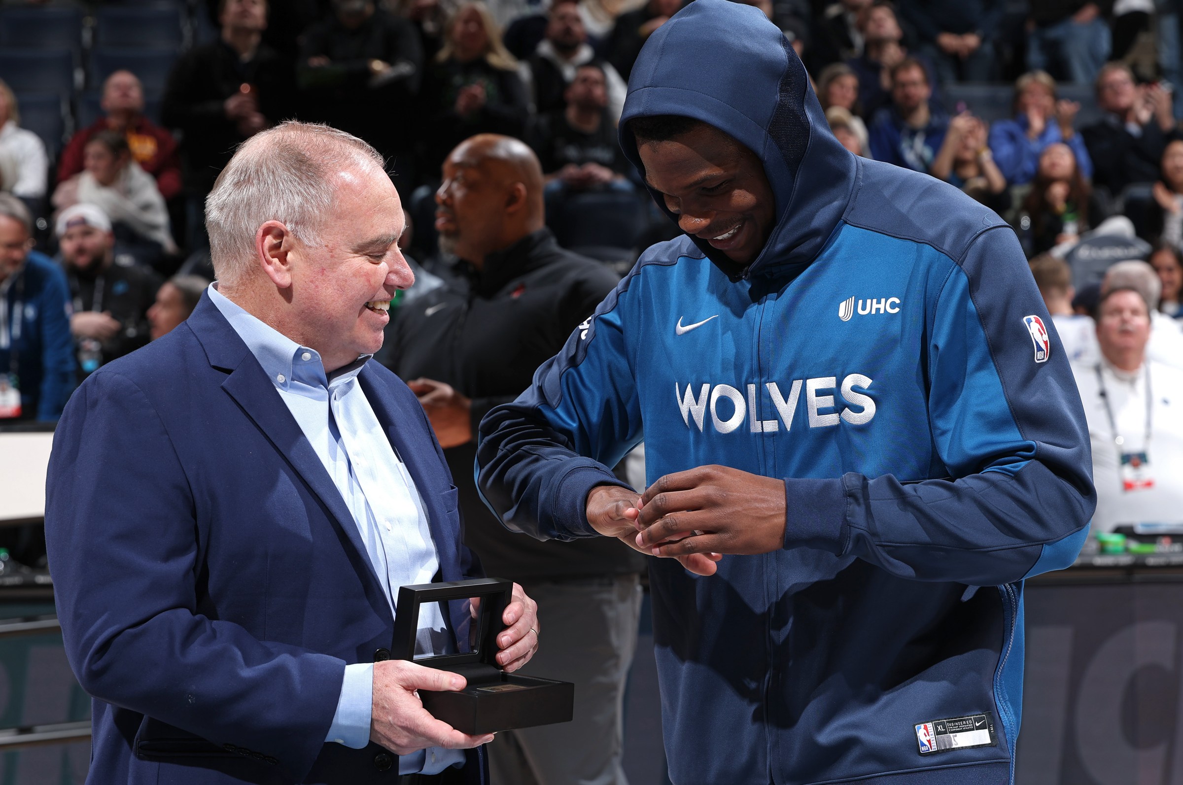 MINNEAPOLIS, MN - FEBRUARY 6: Sean Ford presents Anthony Edwards #5 of the Minnesota Timberwolves the Team USA 2024 Olympic Championship ring before the game against the Houston Rockets on February 6, 2025 at Target Center in Minneapolis, Minnesota. NOTE TO USER: User expressly acknowledges and agrees that, by downloading and or using this Photograph, user is consenting to the terms and conditions of the Getty Images License Agreement. Mandatory Copyright Notice: Copyright 2025 NBAE(Photo by David Sherman/NBAE via Getty Images)