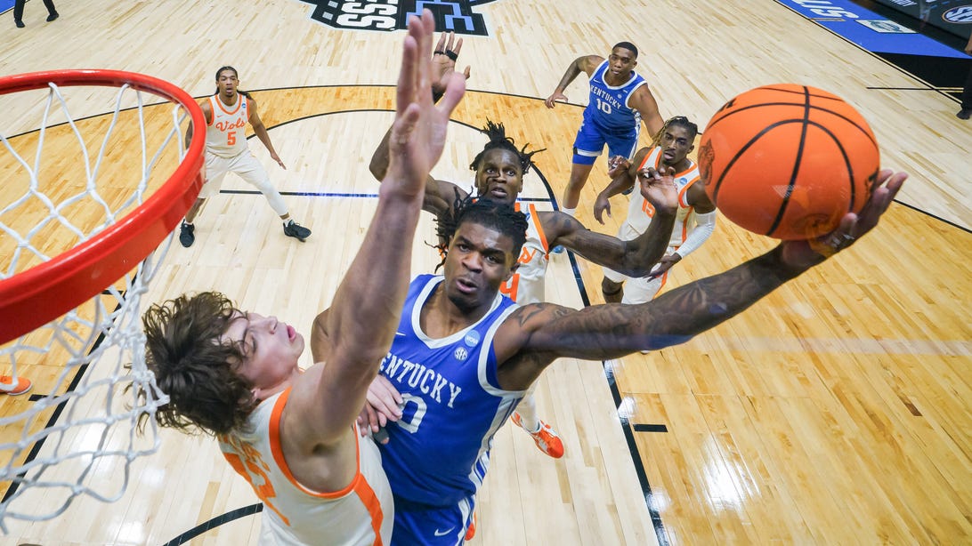 INDIANAPOLIS, INDIANA - MARCH 28: Otega Oweh #00 of the Kentucky Wildcats shoots the ball against Cade Phillips #12 of the Tennessee Volunteers in the Sweet Sixteen round of the 2025 NCAA Men's Basketball Tournament held at Lucas Oil Stadium on March 28, 2025 in Indianapolis, Indiana.