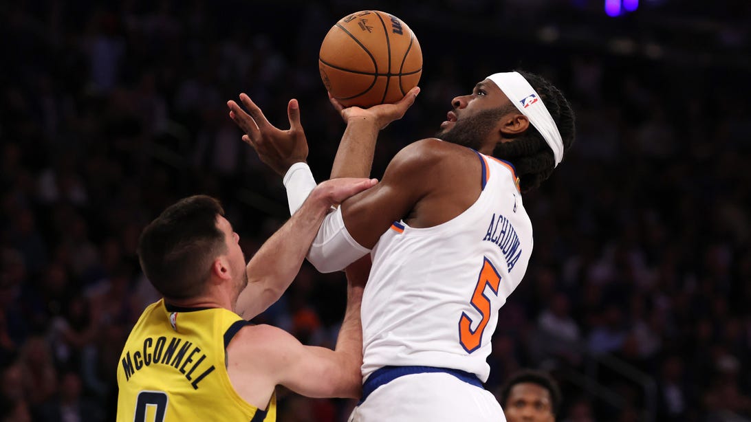 NEW YORK, NEW YORK - MAY 29: Precious Achiuwa #5 of the New York Knicks shoots against T.J. McConnell #9 of the Indiana Pacers during Game 5 of the Eastern Conference Finals at Madison Square Garden on May 29, 2025 in New York City.