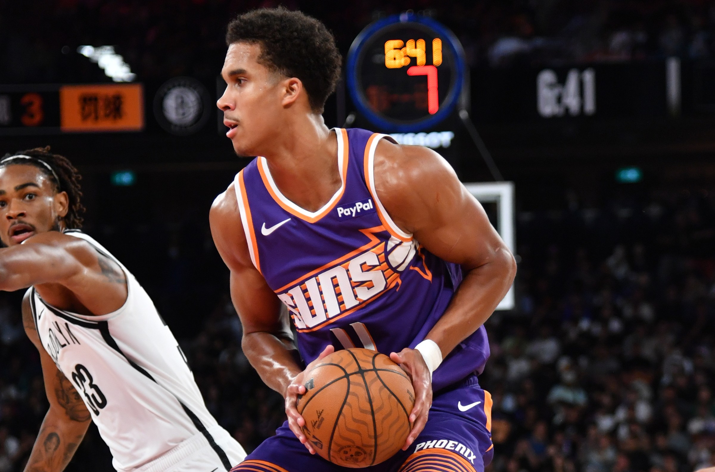 MACAU, CHINA - OCTOBER 10: Oso Ighodaro #11 of the Phoenix Suns drives to the basket during the game against the Brooklyn Nets as part of 2025 NBA Global Games China at Venetian Arena on October 10, 2025 in Macau, China. NOTE TO USER: User expressly acknowledges and agrees that, by downloading and/or using this Photograph, user is consenting to the terms and conditions of the Getty Images License Agreement. Mandatory Copyright Notice: Copyright 2025 NBAE (Photo by Juan Ocampo/NBAE via Getty Images)