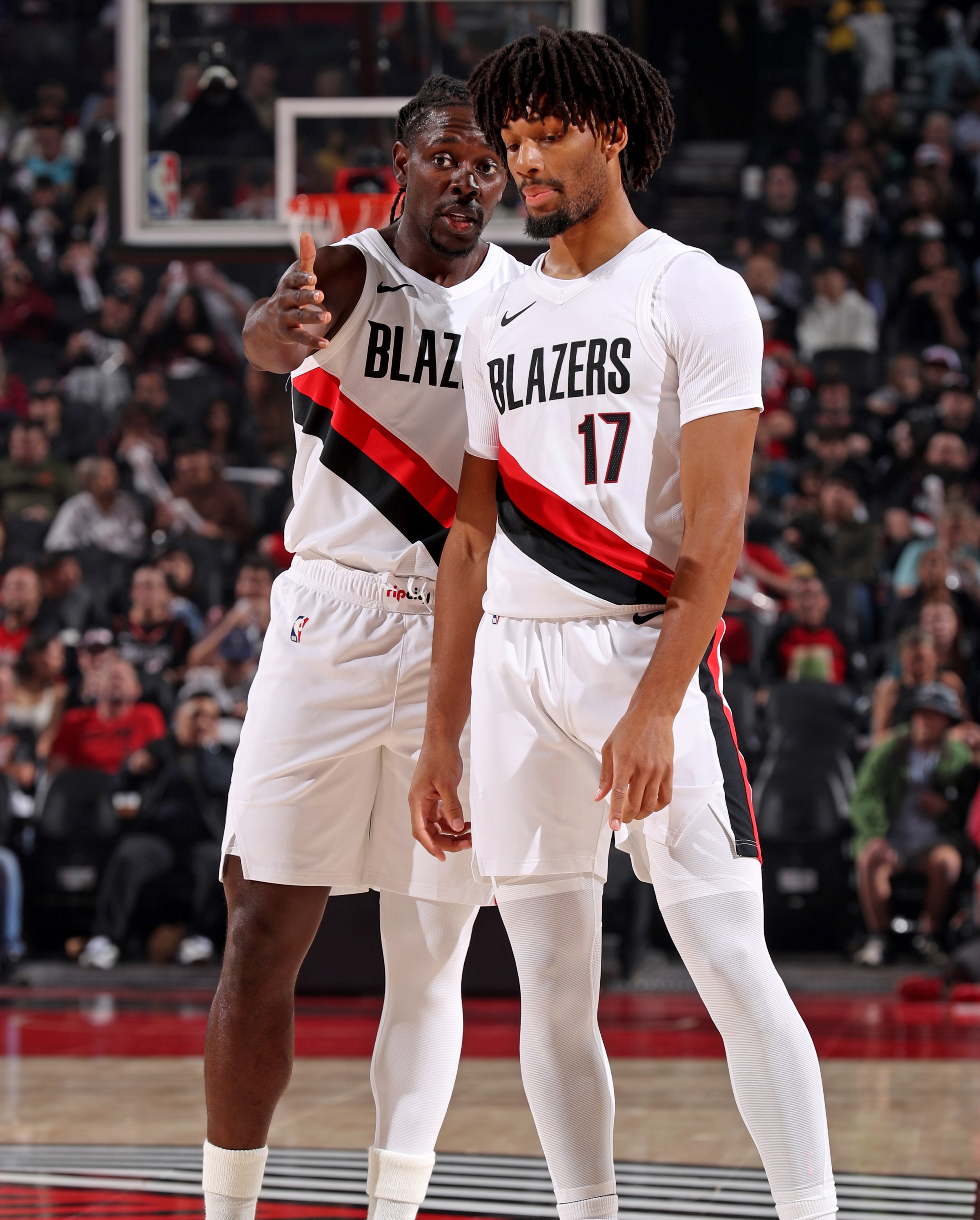 PORTLAND, OR - OCTOBER 10: Jrue Holiday #5 and Shaedon Sharpe #17 of the Portland Trail Blazers talk during the game against the Sacramento Kings on October 10, 2025 at the Moda Center Arena in Portland, Oregon. NOTE TO USER: User expressly acknowledges and agrees that, by downloading and or using this photograph, user is consenting to the terms and conditions of the Getty Images License Agreement. Mandatory Copyright Notice: Copyright 2025 NBAE (Photo by Cameron Browne/NBAE via Getty Images)