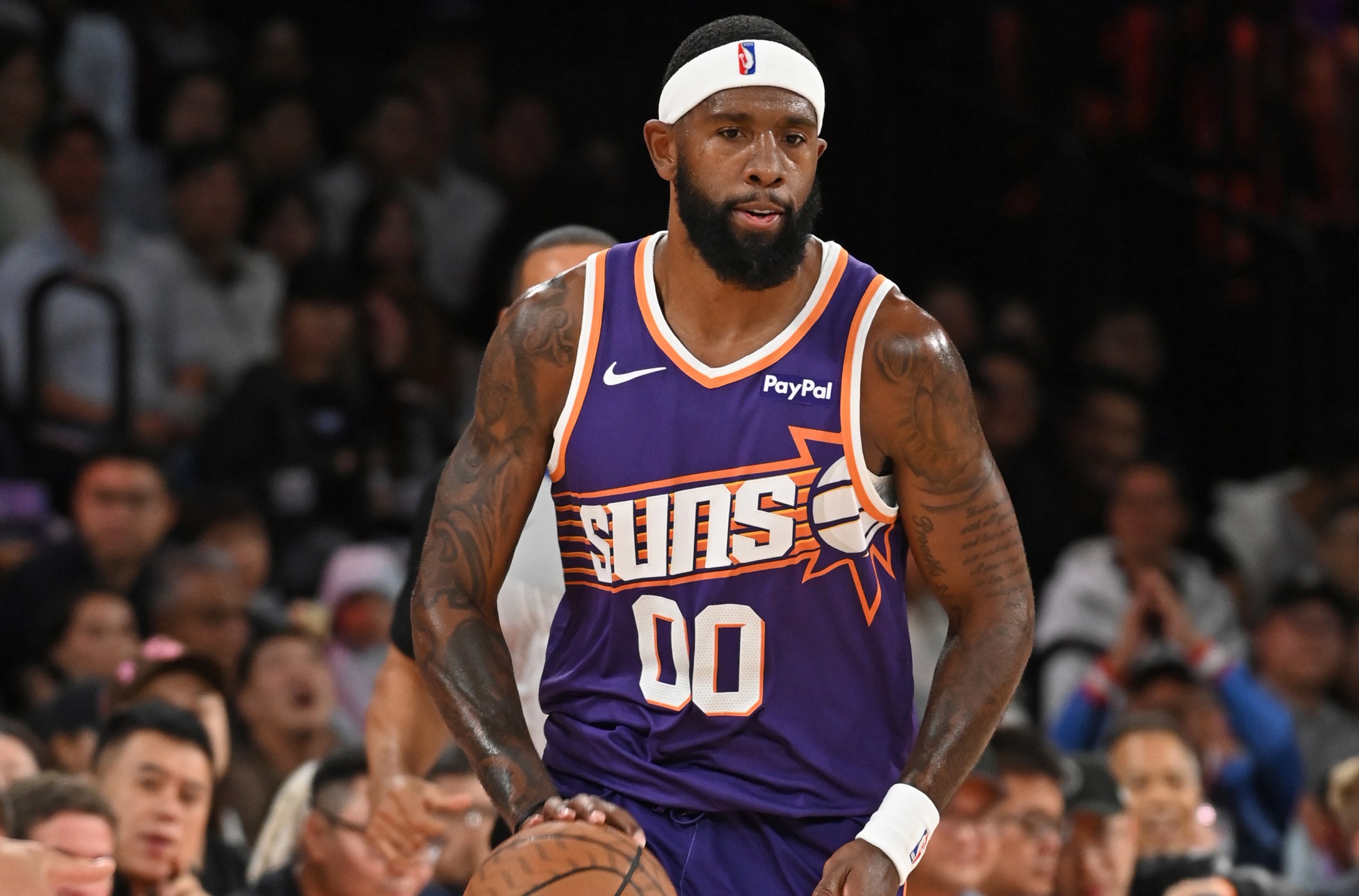 MACAU, CHINA - OCTOBER 12: Royce O’Neale #00 of the Phoenix Suns dribbles the ball during the game against the Brooklyn Nets as part of 2025 NBA Global Games China at Venetian Arena on October 12, 2025 in Macau, China. NOTE TO USER: User expressly acknowledges and agrees that, by downloading and/or using this Photograph, user is consenting to the terms and conditions of the Getty Images License Agreement. Mandatory Copyright Notice: Copyright 2025 NBAE (Photo by Juan Ocampo/NBAE via Getty Images)