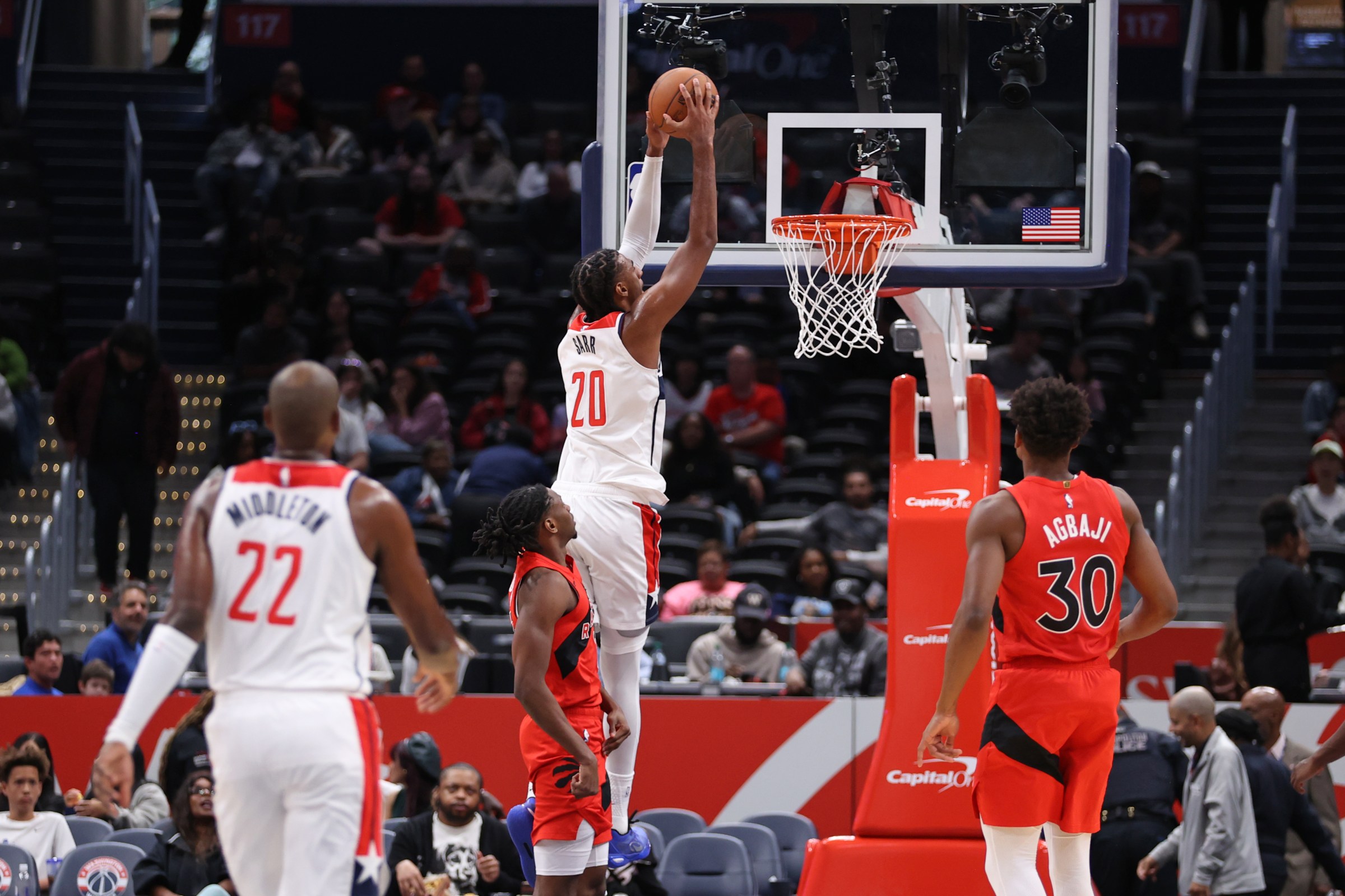 Washington Wizards center Alex Sarr dunks on the Toronto Raptors in game one of the Wizards preseason.