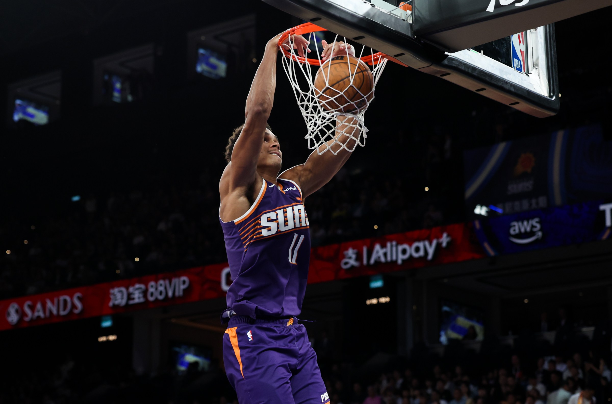 MACAU, MACAU - OCTOBER 10: Oso Ighodaro #11 of Phoenix Suns slam dunk during NBA China Games 2025 between Phoenix Suns and Brooklyn Nets at The Venetian Macao on October 10, 2025 in Macau, Macau. NOTE TO USER: User expressly acknowledges and agrees that, by downloading and/or using this Photograph, user is consenting to the terms and conditions of the Getty Images License Agreement (Photo by Zhizhao Wu/Getty Images)