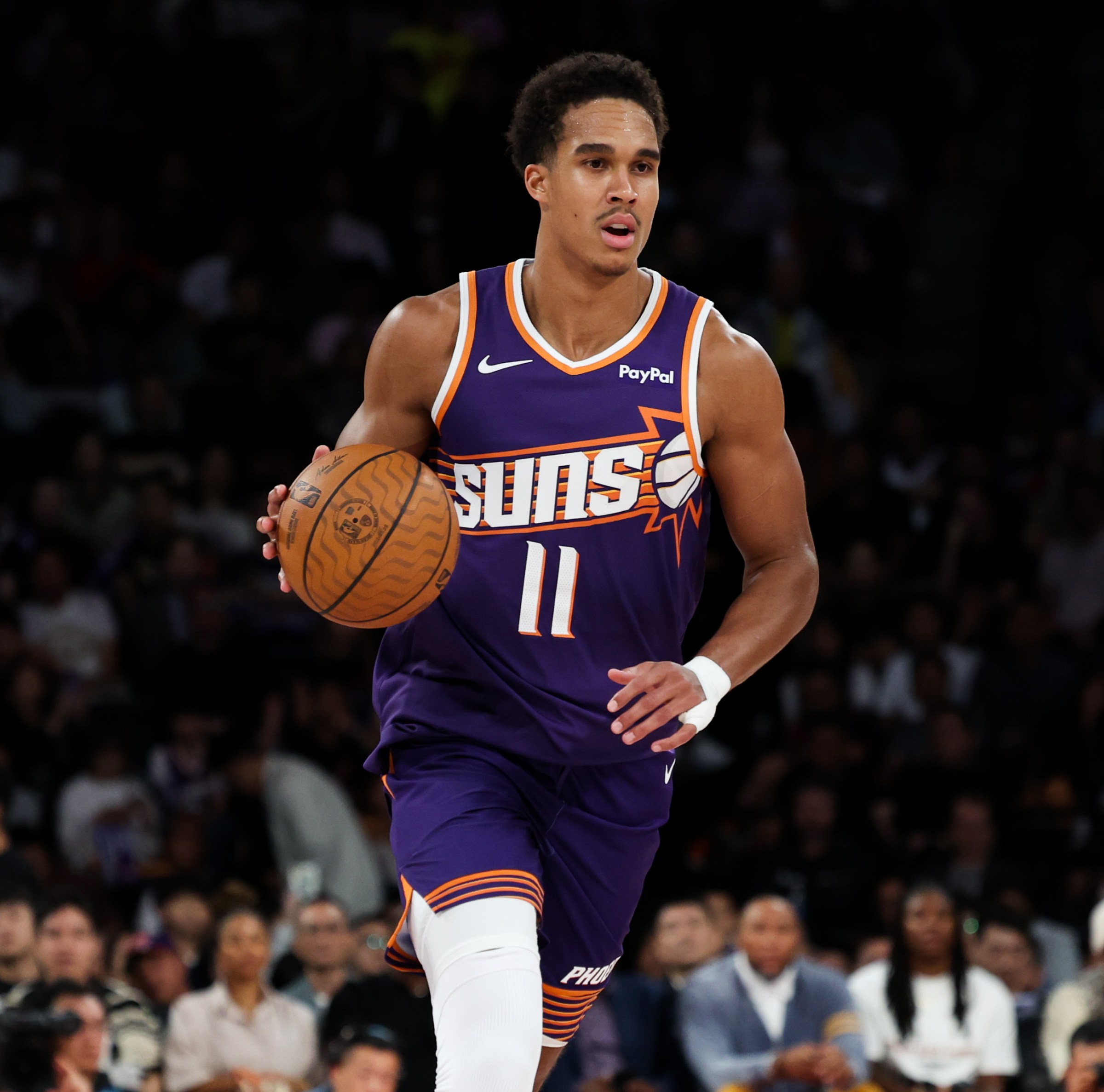 MACAU, MACAU - OCTOBER 10: Oso Ighodaro #11 of Phoenix Suns drives during NBA China Games 2025 between Phoenix Suns and Brooklyn Nets at The Venetian Macao on October 10, 2025 in Macau, Macau. (Photo by Zhizhao Wu/Getty Images)