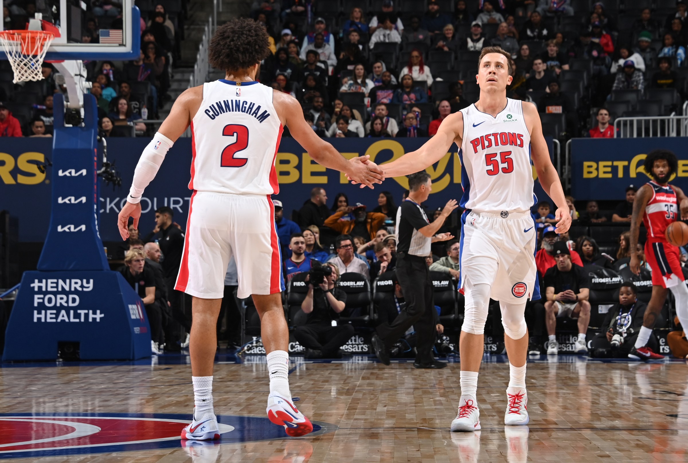 DETROIT, MI - OCTOBER 16: Cade Cunningham #2 & Duncan Robinson #55 of the Detroit Pistons high five during the game against the Washington Wizards during a pre-season game on October 16, 2025 at Little Caesars Arena in Detroit, Michigan. NOTE TO USER: User expressly acknowledges and agrees that, by downloading and/or using this photograph, User is consenting to the terms and conditions of the Getty Images License Agreement. Mandatory Copyright Notice: Copyright 2025 NBAE (Photo by Chris Schwegler/NBAE via Getty Images)