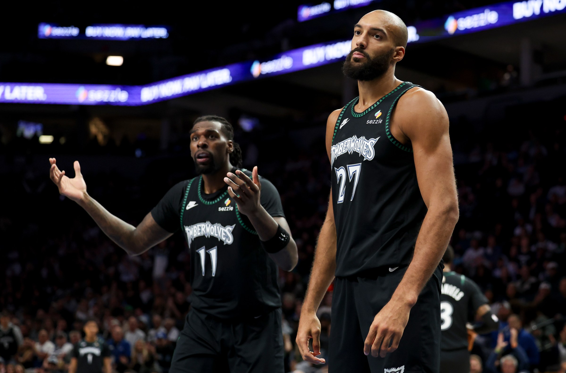 MINNEAPOLIS, MINNESOTA - OCTOBER 27: Naz Reid #11 and Rudy Gobert #27 of the Minnesota Timberwolves react to a foul call during the third quarter against the Denver Nuggets at Target Center on October 27, 2025 in Minneapolis, Minnesota. NOTE TO USER: User expressly acknowledges and agrees that, by downloading and or using this photograph, User is consenting to the terms and conditions of the Getty Images License Agreement. (Photo by Ellen Schmidt/Getty Images)