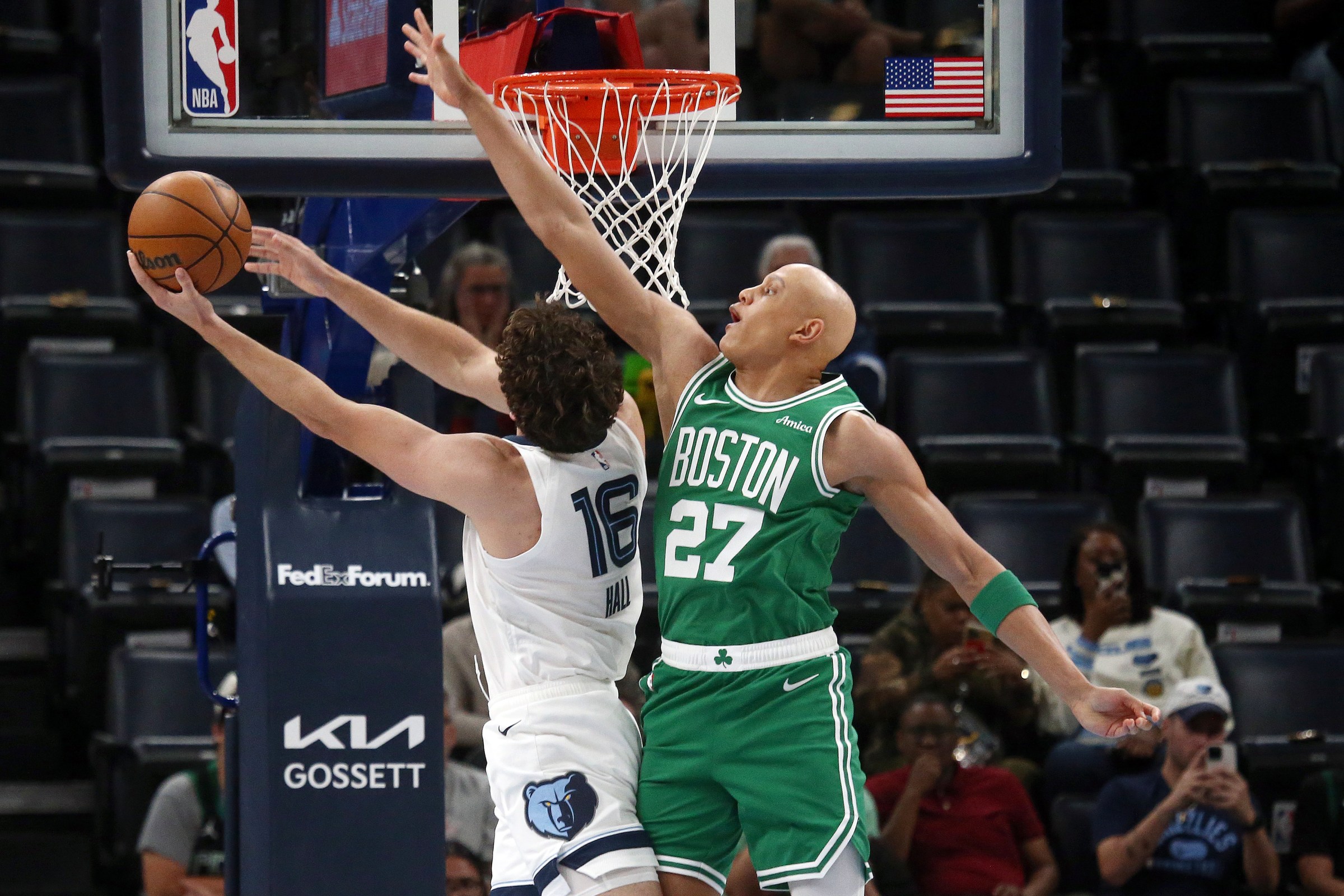 Oct 8, 2025; Memphis, Tennessee, USA; Boston Celtics guard Jordan Walsh (27) defends as Memphis Grizzlies center PJ Hall (16) shoots during the first quarter at FedExForum. Mandatory Credit: Petre Thomas-Imagn Images