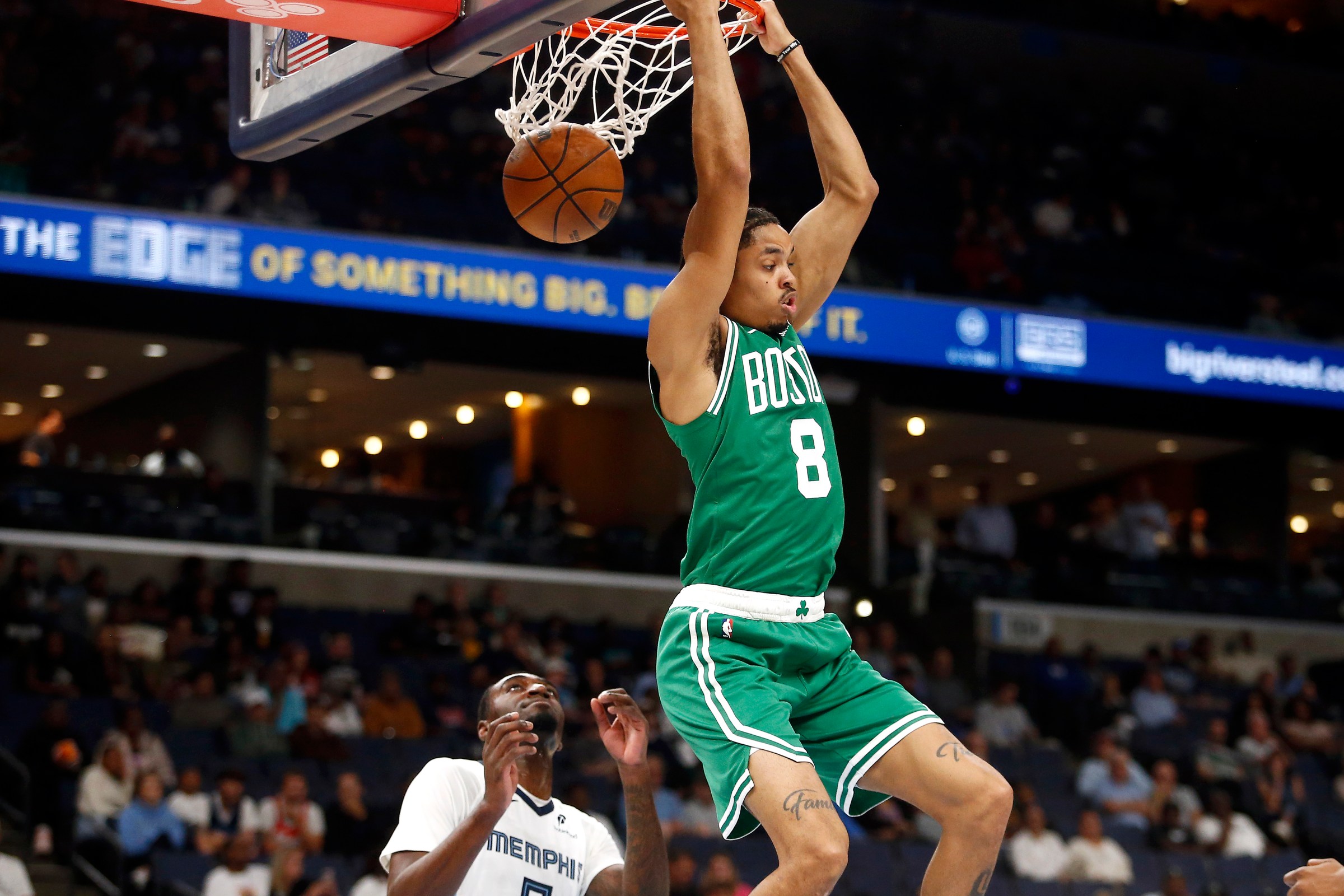 Oct 8, 2025; Memphis, Tennessee, USA; Boston Celtics forward Josh Minott (8) dunks during the second quarter against the Memphis Grizzlies at FedExForum. Mandatory Credit: Petre Thomas-Imagn Images