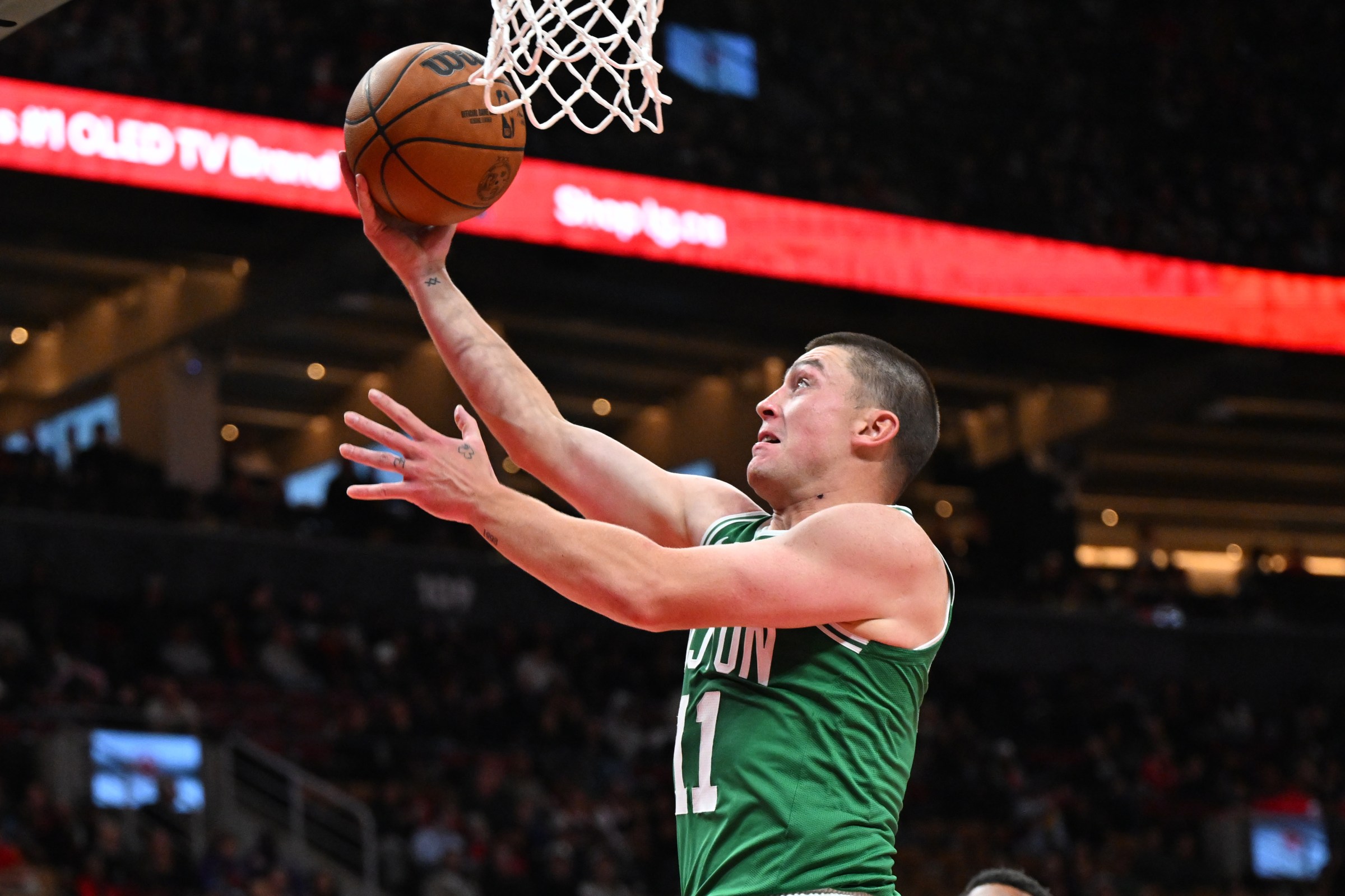 Oct 10, 2025; Toronto, Ontario, CAN; Boston Celtics guard Payton Pritchard (11) shoots the ball against the Toronto Raptors in the first half at Scotiabank Arena. Mandatory Credit: Dan Hamilton-Imagn Images