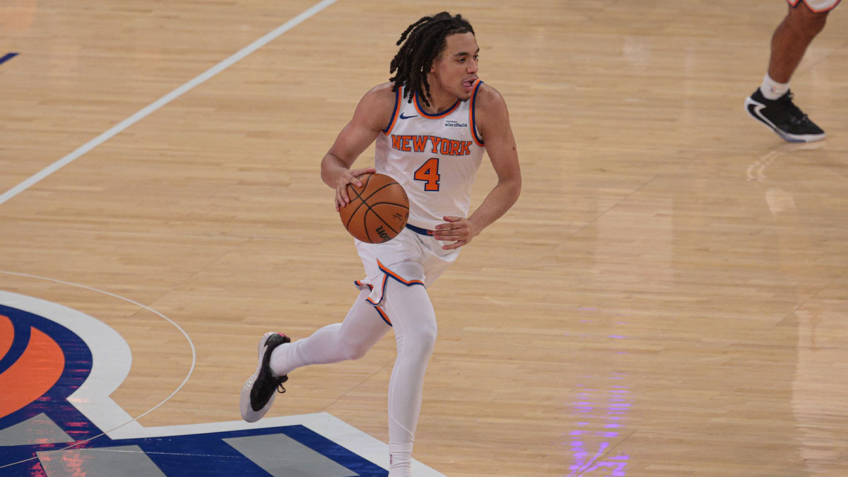New York Knicks forward Pacome Dadiet (4) dribbles up court against the Washington Wizards during the first quarter at Madison Square Garden.