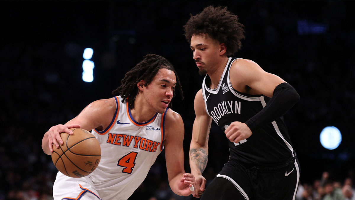 Apr 13, 2025; Brooklyn, New York, USA; New York Knicks guard Pacome Dadiet (4) dribbles after the game Brooklyn Nets forward Jalen Wilson (22) during the first half at Barclays Center. Mandatory Credit: Vincent Carchietta-Imagn Images