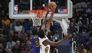 Los Angeles Lakers forward Anthony Davis (3) and New Orleans Pelicans center Yves Missi battle under the basket in the first half of an NBA basketball game in New Orleans, Saturday, Nov. 16, 2024. (AP Photo/Gerald Herbert)