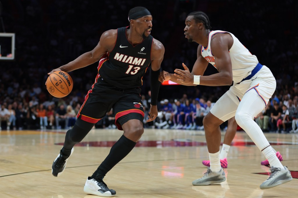 Miami Heat center Bam Adebayo (13) drives to the basket against New York Knicks center Ariel Hukporti (55).