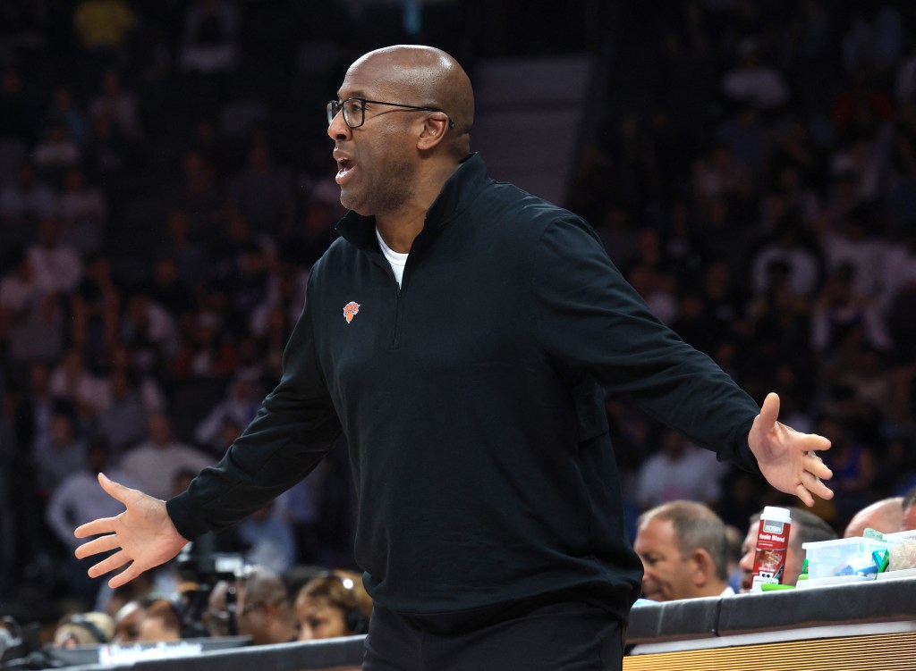 New York Knicks coach Mike Brown reacting at a game.
