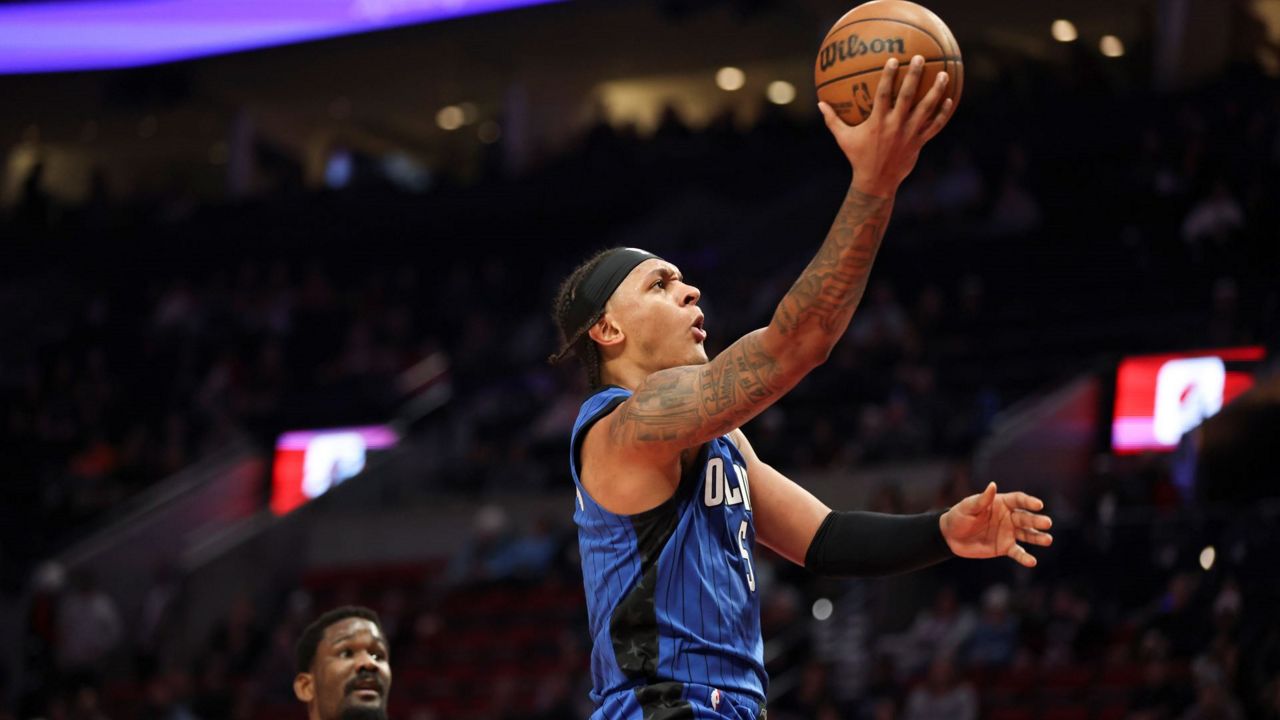 Magic forward Paolo Banchero warming-up before a preseason game against the New Orleans Pelicans. (Brandon Green/Spectrum Sports 360)