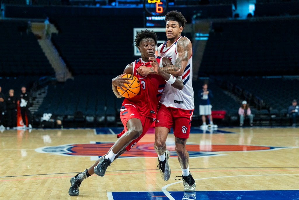 Joson Sanon drives around Dillon Mitchell during a St. John's scrimmage at Madison Square Garden on Oct. 8, 2025.