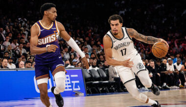 The Brooklyn Nets' Michaerl Porter Jr. #17 (R) dribbles during the NBA pre-season game between the ...