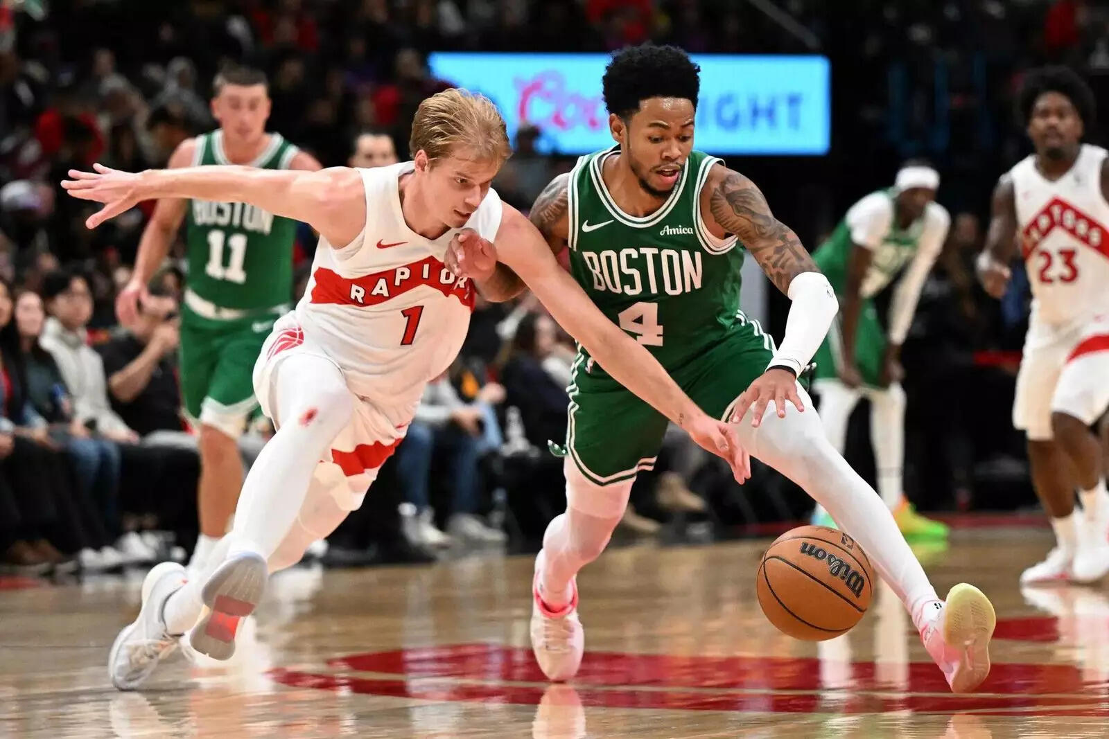Toronto Raptors forward Gradey Dick (1) knocks the ball away from Boston Celtics guard Anfernee Simons (4) (Image via Imagn) Toronto Raptors forward Gradey Dick (1) knocks the ball away from Boston Celtics guard Anfernee Simons (4)
