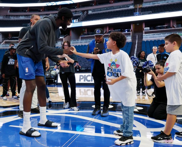 Jonathan Isaac plays rock paper scissors with a student during the annual Pick, Read and Roll event hosted by the Orlando Magic and Orange County Public Schools (OCPS), at Kia Center, on Monday, Oct. 20, 2025. (Ricardo Ramirez Buxeda/Orlando Sentinel)