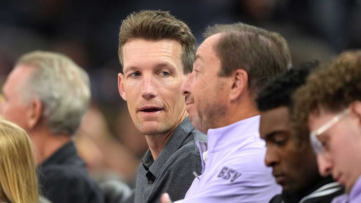 Golden State Warriors general manager Mike Dunleavy (center left) talks with Golden State Valkyries co-owner Joe Lacob (center right) during the fourth quarter against the Indiana Fever at Chase Center.