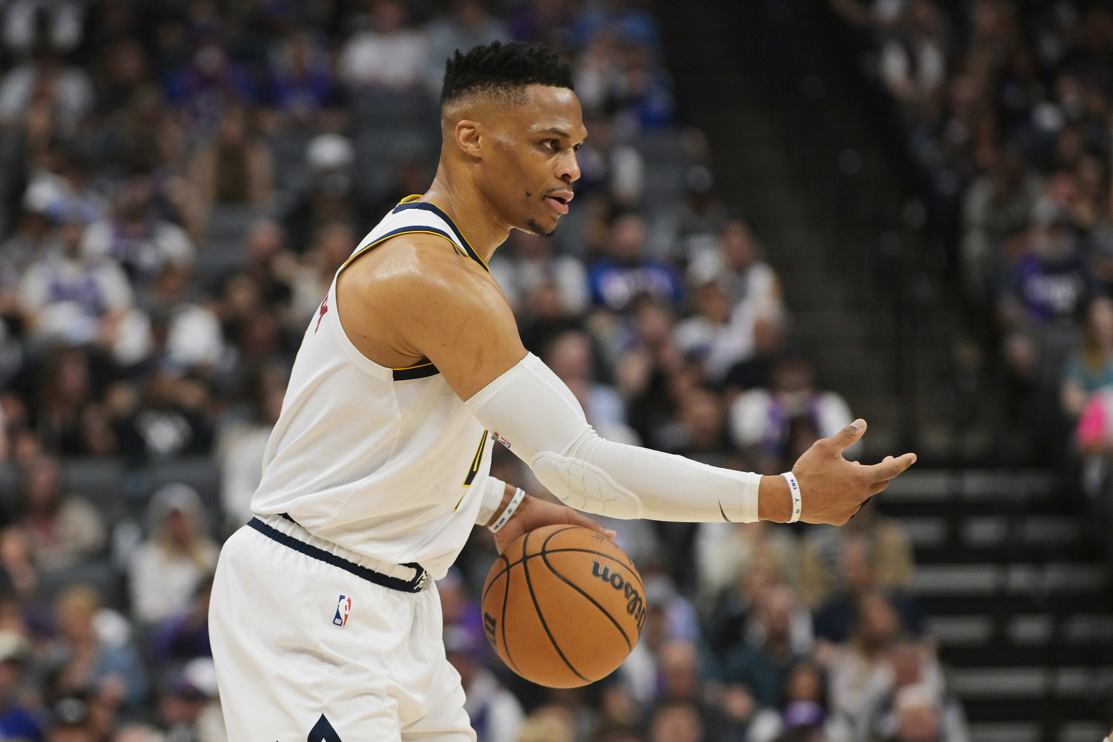 Apr 9, 2025; Sacramento, California, USA; Denver Nuggets guard Russell Westbrook (4) directs his team against the Sacramento Kings during the first quarter at Golden 1 Center. Mandatory Credit: Ed Szczepanski-Imagn Images