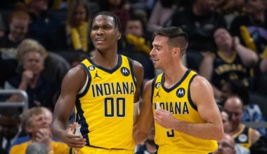 Oct 21, 2022; Indianapolis, Indiana, USA; Indiana Pacers guard Bennedict Mathurin (00) and guard T.J. McConnell (9) after a foul in the first half against the San Antonio Spurs at Gainbridge Fieldhouse. Mandatory Credit: Trevor Ruszkowski-Imagn Images