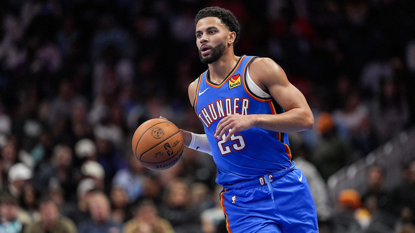 Nov 15, 2025; Charlotte, North Carolina, USA; Oklahoma City Thunder guard Ajay Mitchell (25) brings the ball up court against the Charlotte Hornets during the second half at Spectrum Center. Mandatory Credit: Jim Dedmon-Imagn Images