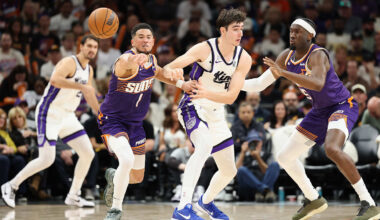 Phoenix Suns teammates Devin Booker and Mark Williams play defense during a game against the Sacramento Kings.